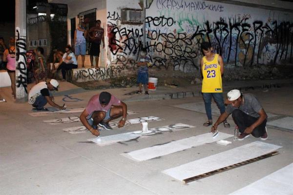 Aprehenden y multan a joven por grafiti en el malecón de los pobres