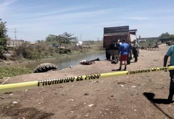 Encuentran a hombre asesinado en canal del Campo El Diez