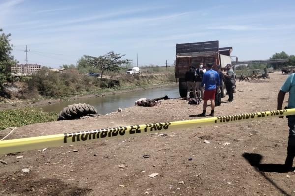 Encuentran a hombre asesinado en canal del Campo El Diez