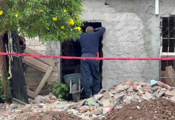 Buscan más restos humanos en una casa de Los Laureles, horas antes encontraron a una mujer enterrada