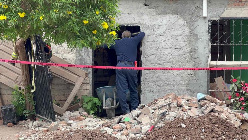 Buscan más restos humanos en una casa de Los Laureles, horas antes encontraron a una mujer enterrada