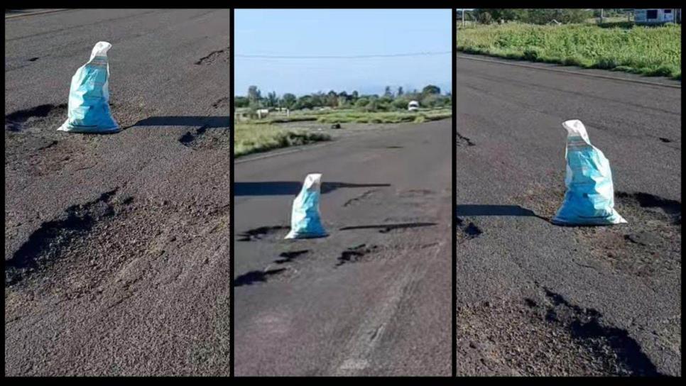 Colocan costales en la carretera México 15 para alertar de megabaches