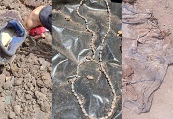 Encuentran anillos, rosario y camiseta en fosa clandestina de Guasave; buscan identificar a las víctimas